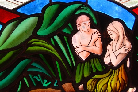 Stained Glass window segment of Adam and Eve in the Garden of Edenのeditorial素材