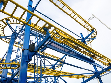 Yellow and Blue rollercoaster track from below