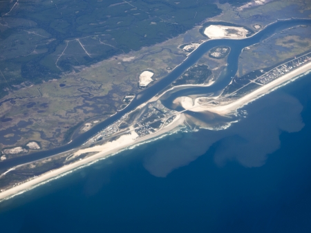 Aerial at 30000 Feet of Coastline with Outlet to the Seaの写真素材