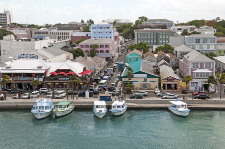 NASSAU, BAHAMAS - MAY 27, 2015: Nassau Bahamas busy tourist district with boat shuttles tied up waiting for toursのeditorial素材