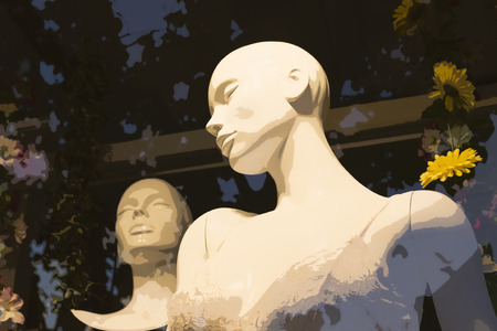 Two white mannequins in window displayの写真素材