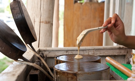 kind of Thai sweetmeat . Coconut milk mix poppy with powder frie の写真素材