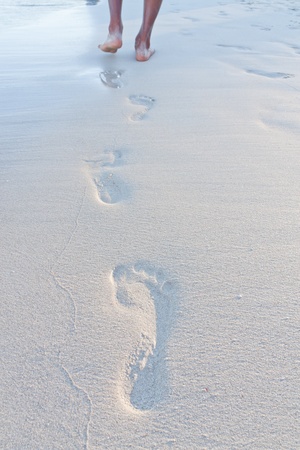 Footprints on the beach の写真素材