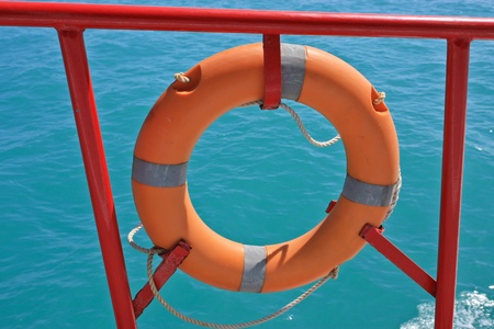 Safety orange buoy on shipの写真素材