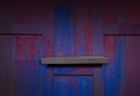wooden shelf on old color wood wall 	wooden shelf on old color wood wallの写真素材