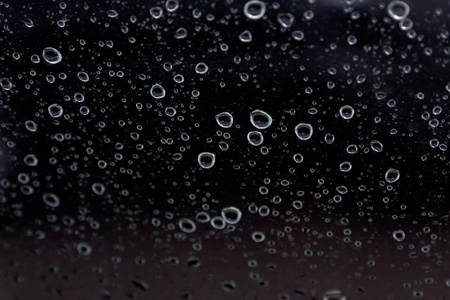 rain drop on abstract black background の写真素材