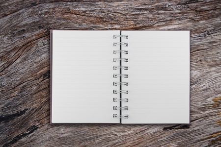 open notebook on natural surface of old teak wood backgroundの写真素材