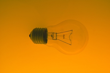 light bulb on gradient  orange  backgroundの写真素材