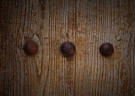 rusty metal decoration on wooden door