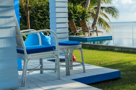 swimming pool overlooking the sea and skyの写真素材