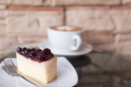 Hot coffee  and blueberry cheesecake の写真素材