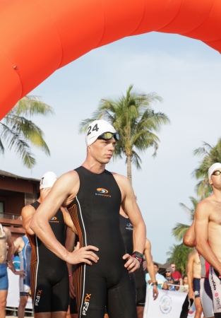 SAMUI, THAILAND - APRIL 21 2013-: Samui Triathlon 2013 event. Competitors in action during the triathlon on Sunday 21 April 2013 in Ko Samui island, Suratthani, Thailand.のeditorial素材