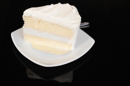 coconut cake on black glass tableの写真素材