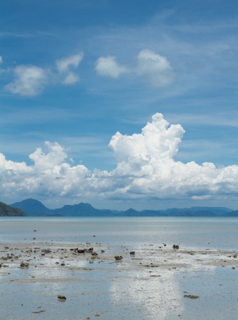Seascape with big white clouds,sky and blue skyの写真素材