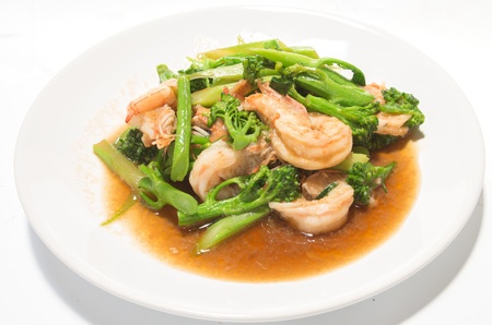 Prawns with broccoli fried sauce on white dishの写真素材