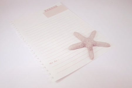 Paper note starfish paperweightの写真素材