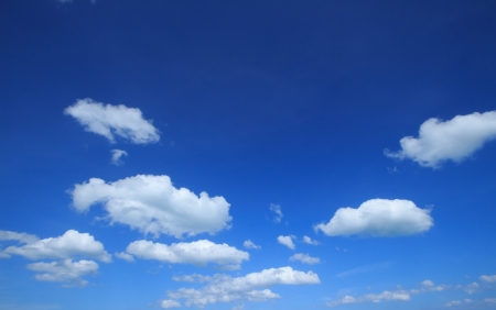 Blue sky and small  white clouds backgroundの写真素材