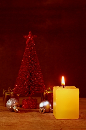 Christmas candle ornaments decoration on wooden backgroundの写真素材