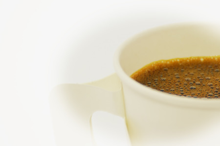 Steaming paper coffee cup in vintage style,selective focusの写真素材