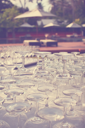 Wine glasses   arrange on table outdoors with vintage filter effectの写真素材