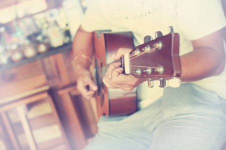 Guitarist plays guitar in vintage styleの写真素材