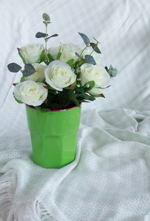 Rose bunch flower in green cup for decoration の写真素材
