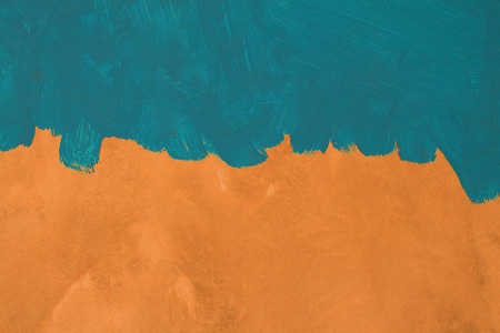 Green painted brush texture on orange cement wall background