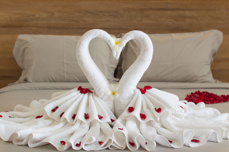Bedroom interior design with swans from the towel decoration on bedの写真素材