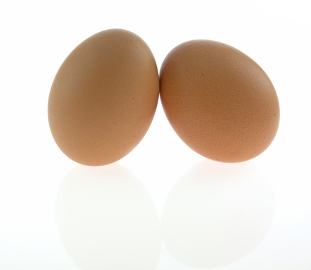 Fresh double eggs isolated on white backgroundの写真素材