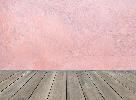 Wooden floor and pastel pink backgroundの写真素材
