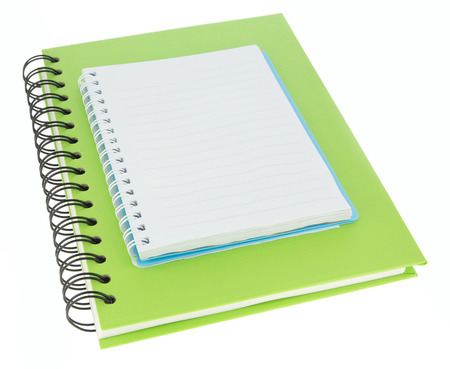 Green and blue notebook paper isolated on white backgroundの写真素材
