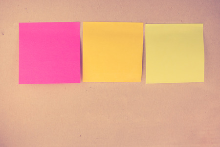 Colorful memo on vintage paper cardboard background