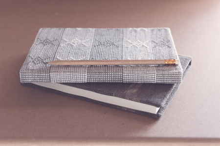 Open notebook on grunge wooden background,retro filter effectの写真素材