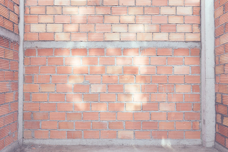 Red brick wall  background under house construction,retro filter effect