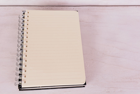 Open notebook on grunge background,vintage style