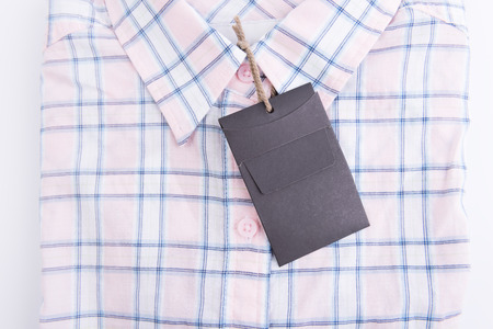 Blue pink plaid shirt background with price tagの写真素材