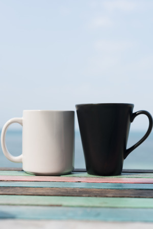 Black and white coffee cup on vintage tableの写真素材