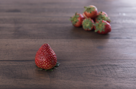 Strawberry fruits on grunge wood backgroundの写真素材