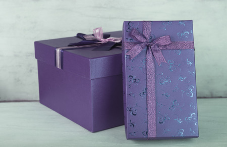 Gift boxes on grunge white wood backgroundの写真素材