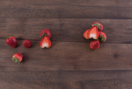 Strawberry fruits on grunge wood backgroundの写真素材