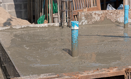 Blue plastic tube on concret pouring area