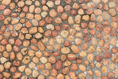 Pebble stone wall backgroundの写真素材