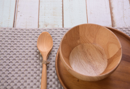 Wood kitchen utensils over grunge wooden table backgroundの写真素材