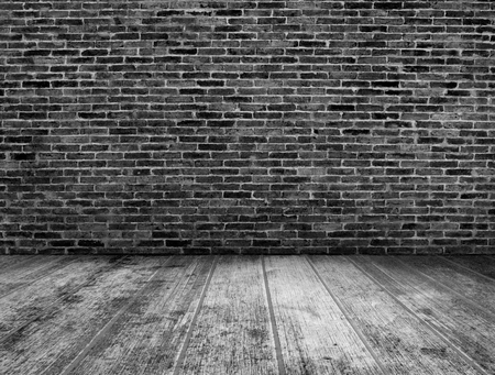 Black and white grunge room interior with brick wall backgroundの写真素材