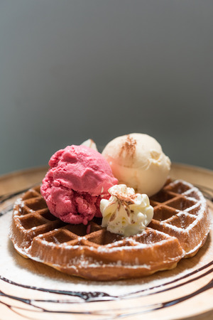 Strawberry and Vanilla icecream with honey toastの写真素材