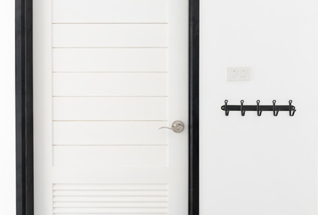 White wooden door interior modern room with black hangerの写真素材
