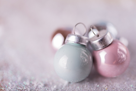 Shiny Christmas balls over snow backgroundの写真素材