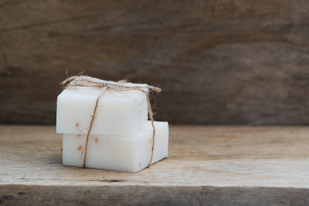 Handmade  coconut milk soap on wooden top backgroundの写真素材