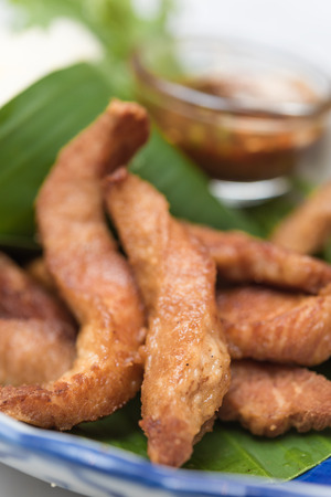 Fried pork,treadition Thai menu set on banana leafの写真素材
