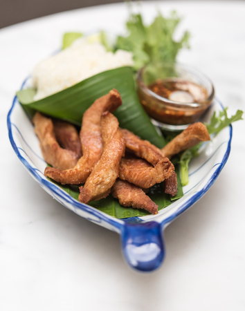 Fried pork,treadition Thai menu set on banana leafの写真素材